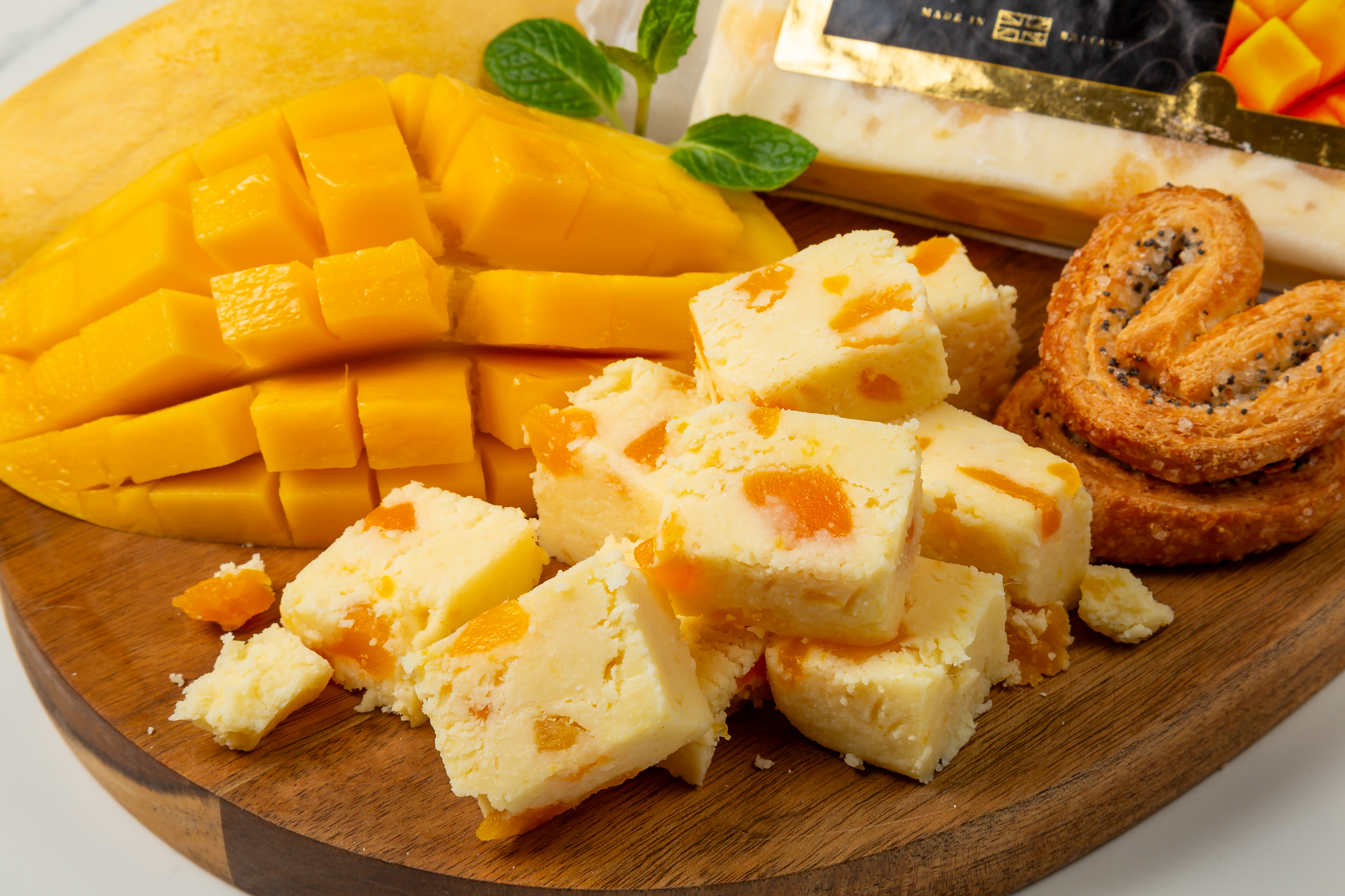 Wensleydale Mango & Ginger cheese block with visible fruit pieces – Britannia Farm