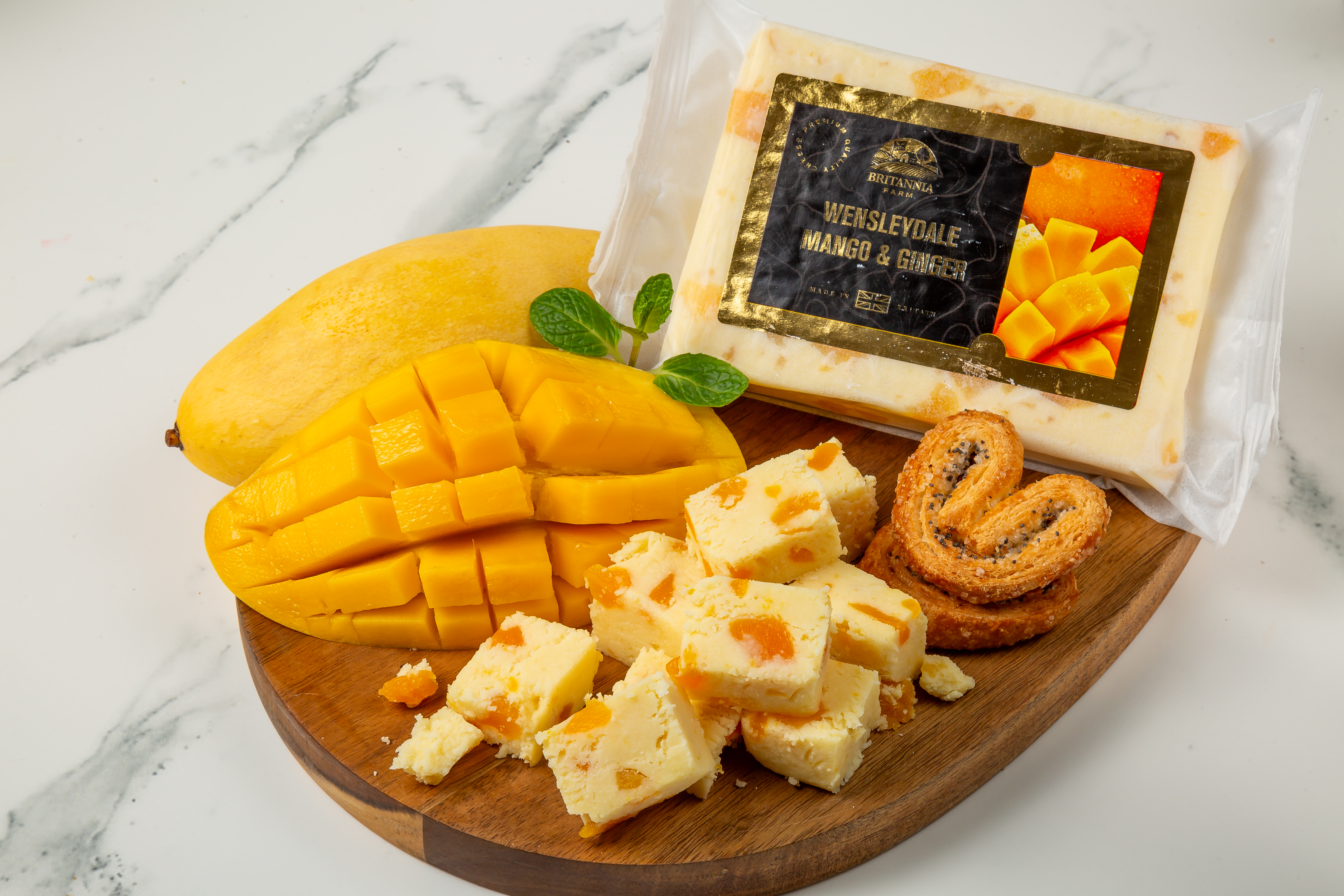 Wensleydale Mango & Ginger cheese block with visible fruit pieces – Britannia Farm